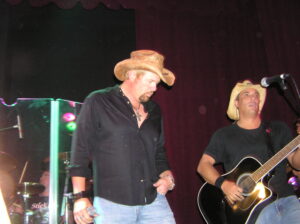 LL performing with Toby Keith